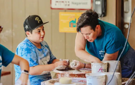 a person and a boy preparing food