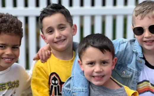 a group of boys smiling