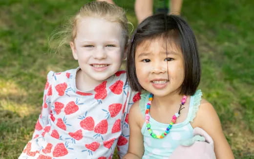 a couple of children smiling