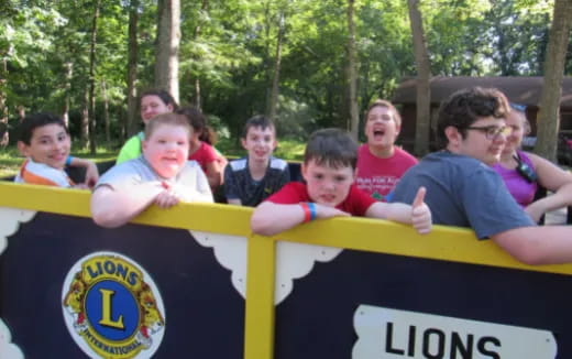 a group of people holding a banner