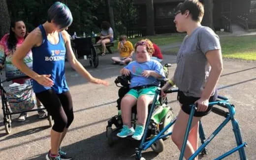 a group of people pushing a child in a stroller