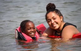 a couple of women in the water