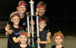 a person holding a group of children