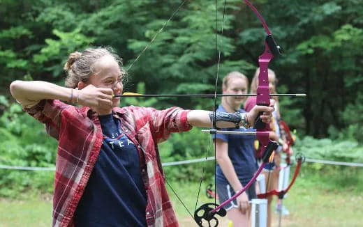 a person holding a bow and arrow