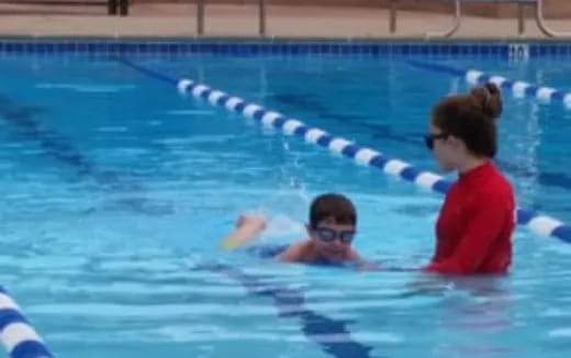 a man and a woman in a pool
