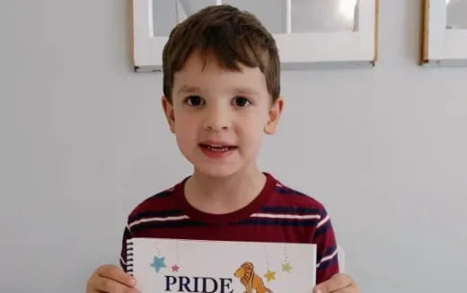 a boy holding a sign