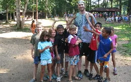a group of children standing together outside