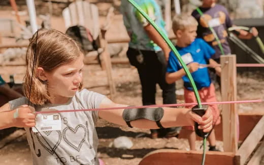 a young girl playing with a toy