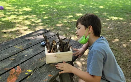 a boy holding a toy gun