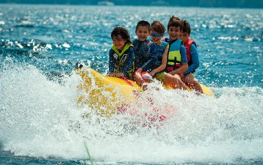 a group of people riding a raft