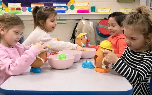 a group of children playing with toys