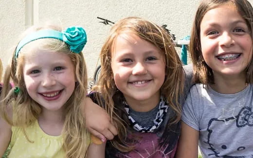 a group of girls smiling