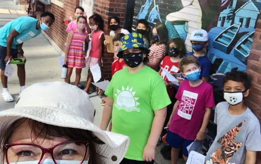 a group of children wearing masks