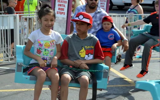 a group of people sitting on a bench