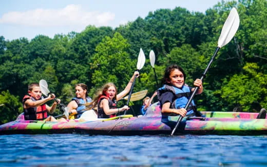 a group of people in a canoe