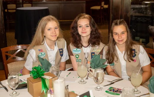 a group of women sitting at a table