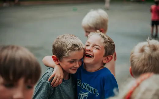 a group of boys laughing