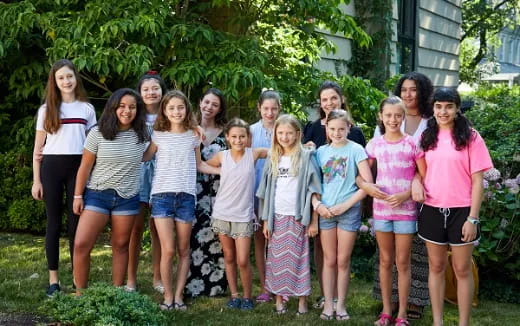 a group of girls posing for a photo