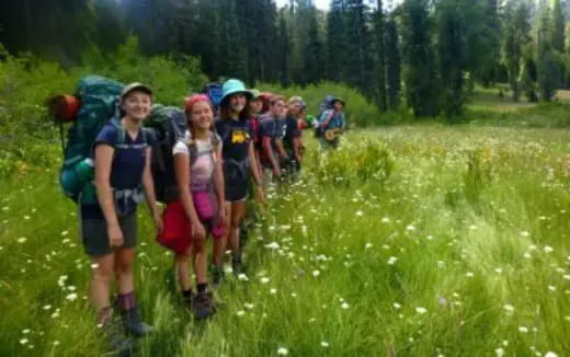 a group of people hiking in the woods