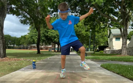 a boy jumping in the air