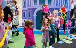 a group of children in a play area