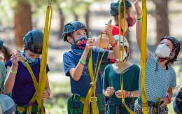 a group of people wearing helmets