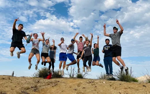 a group of people jumping in the air
