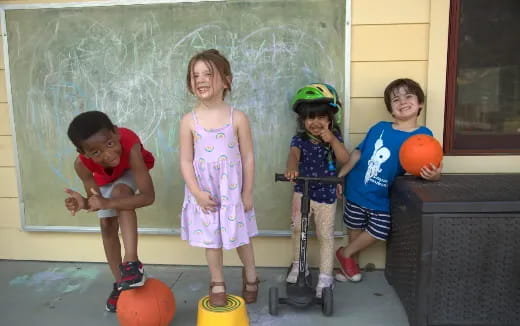 a group of kids playing with toys