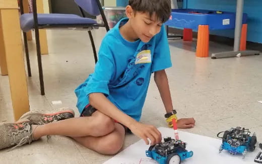 a boy playing with toys