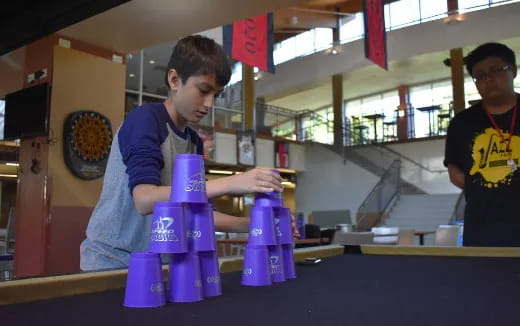 a man pouring liquid into a container