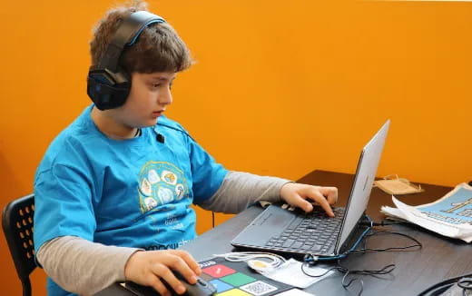 a boy using a laptop