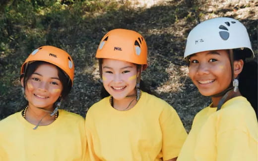 a group of people wearing hard hats