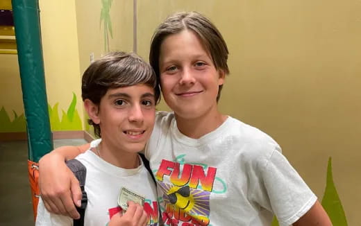 a boy and girl posing for a picture