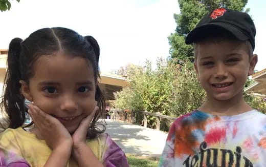 a couple of children smiling