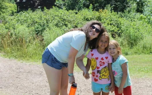 a person and two girls