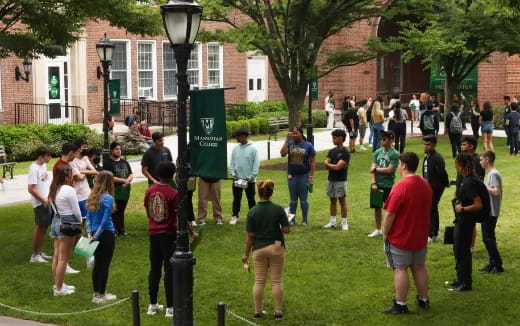 a group of people standing on grass