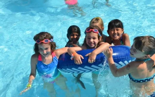 a group of girls in a pool