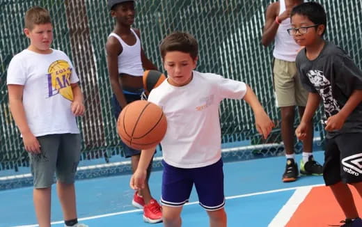 a boy holding a basketball