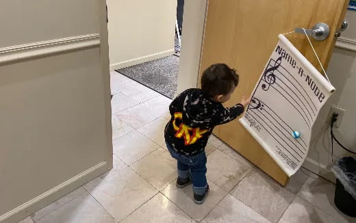 a child holding a sign