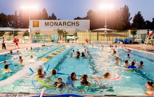 a group of people in a pool