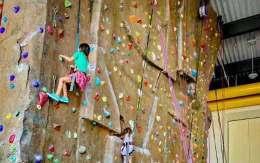 a person climbing a rock wall