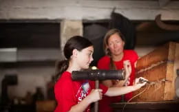 a man and woman playing instruments