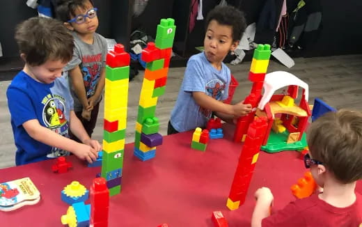a group of kids playing with toys