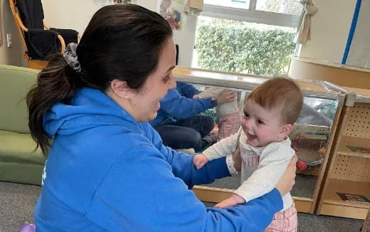 a person holding a baby