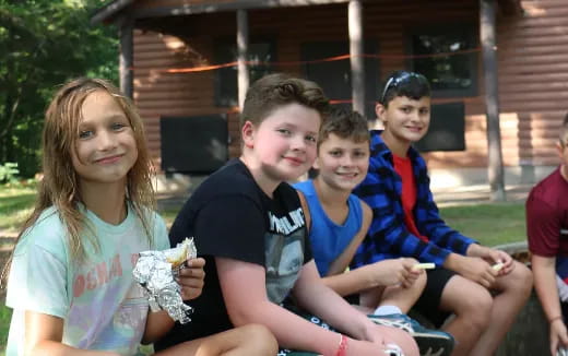a group of people sitting on a bench