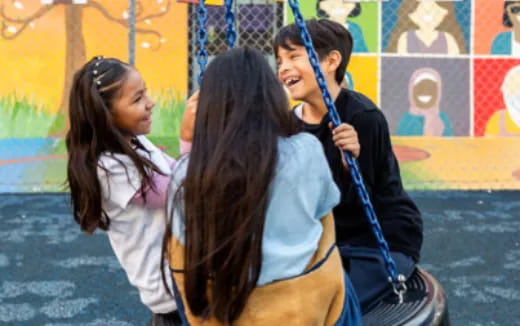 a couple of girls playing tennis
