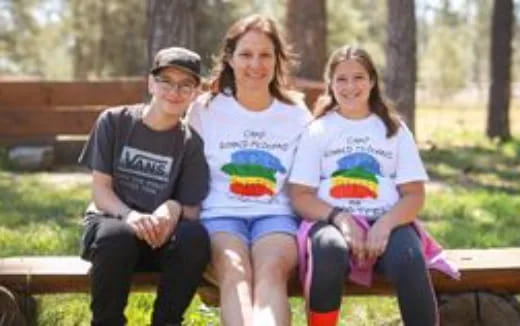 a group of people sitting on a bench