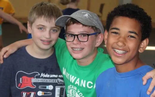 a group of boys smiling