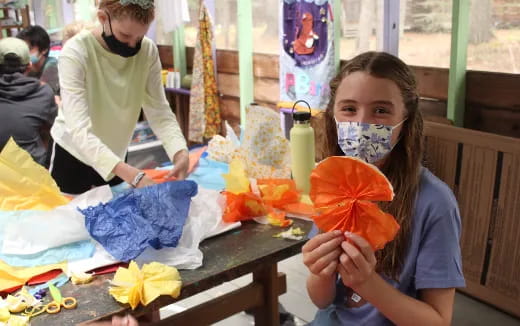 a person painting a pumpkin
