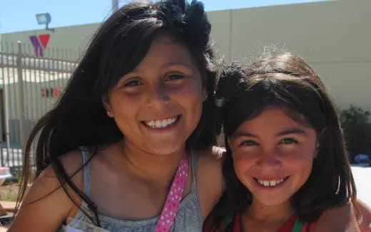 a couple of girls smiling